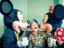 Little boy with Mickey and Minnie Mouse