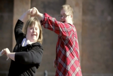 Man and woman with down syndrome dancing