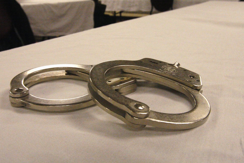 Handcuffs used on men arrested for prostitution solicitation sit on a table at a hotel in Minot, N.D., on Saturday, Jan. 31, 2015. Sex trafficking has become a big problem in North Dakota amid an oil boom that has brought in money and oil workers. The Minot police sting ended with the arrests of 13 men, who answered ads on an escort website posted by the undercover officers. (AP Photo/Martha Irvine)