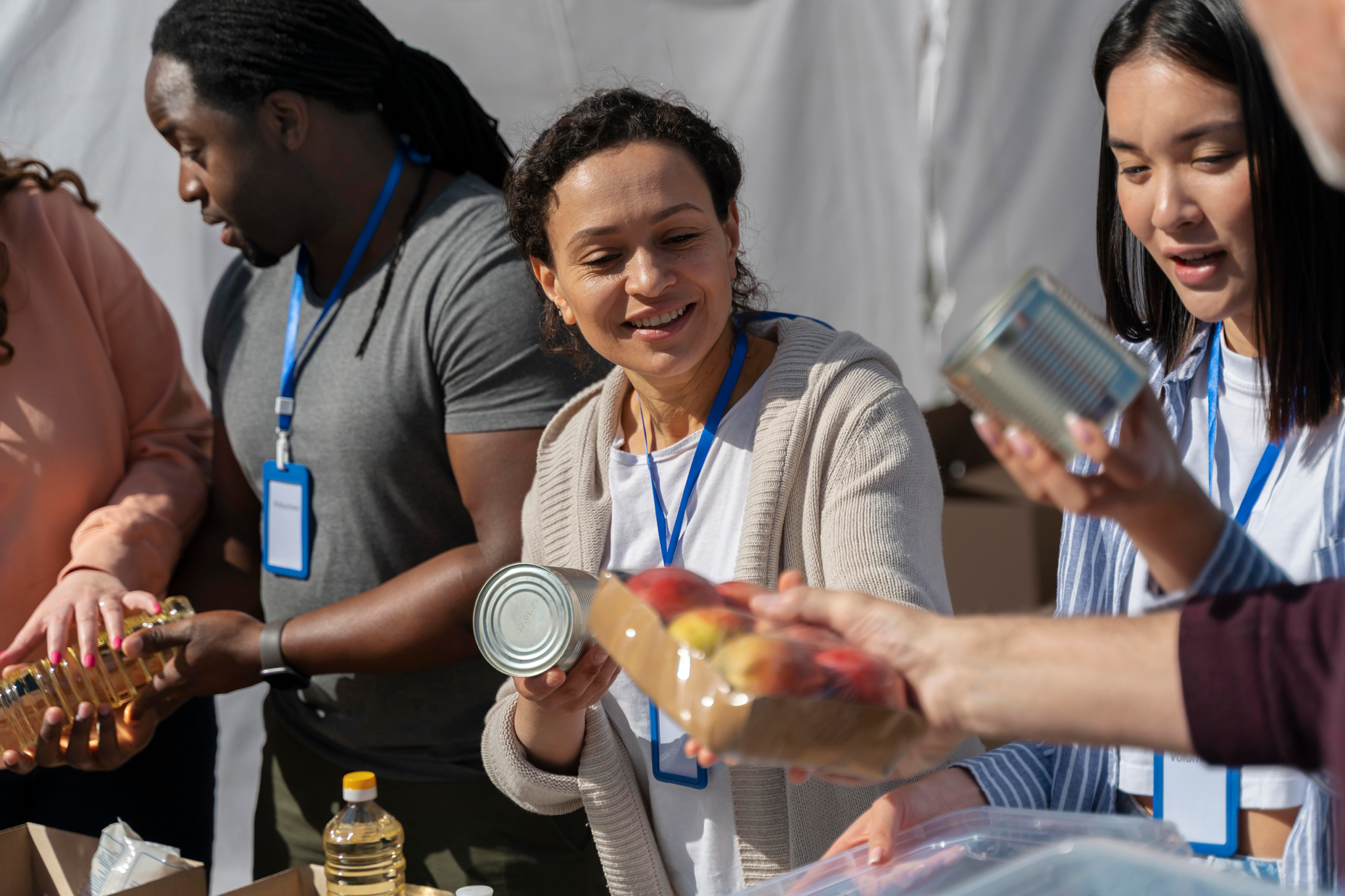 Charity food. People doing Volunteer work. Charity worker. Voluntary work. Core services.